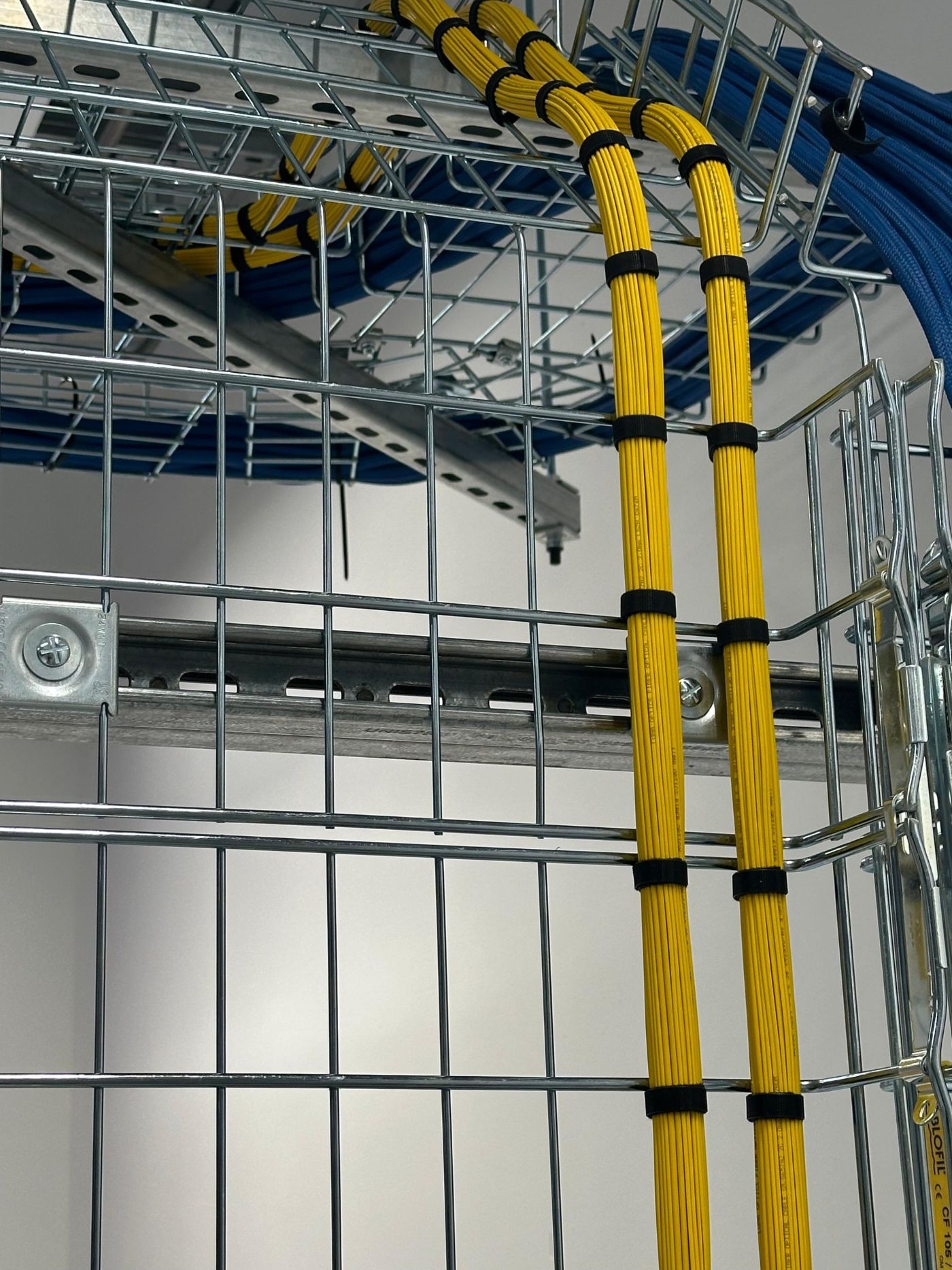 Yellow fibre bundles dressed down a cable basket